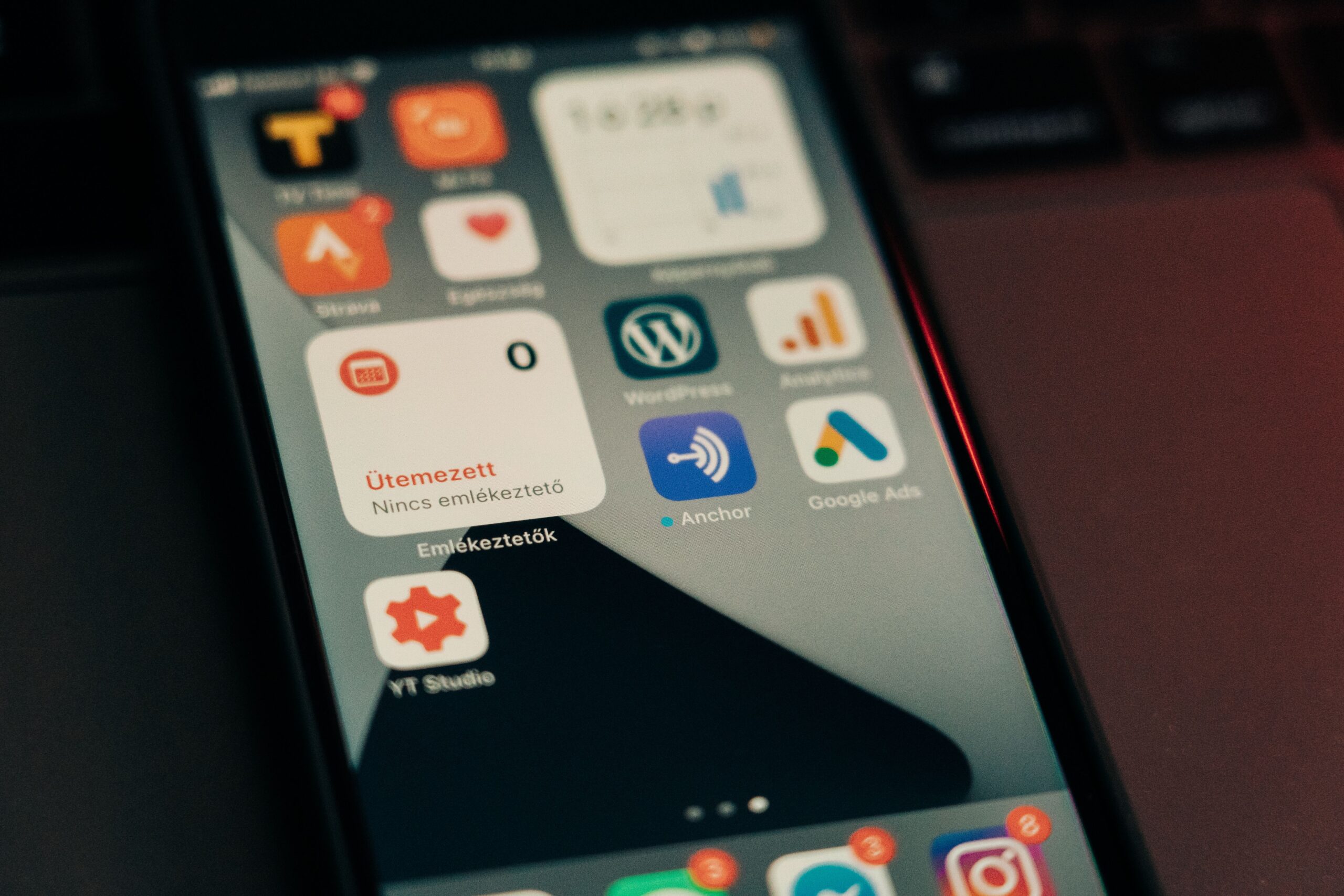 About Close-up view of smartphone screen featuring various app icons and notifications.